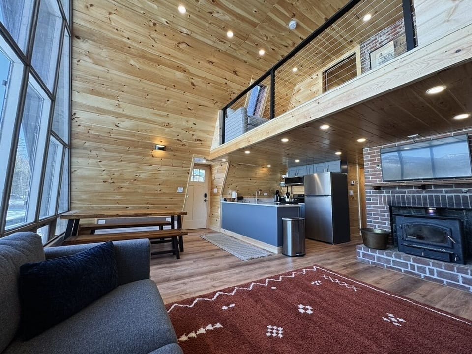 The entire A-frame is finished using locally sourced, knotty pine.