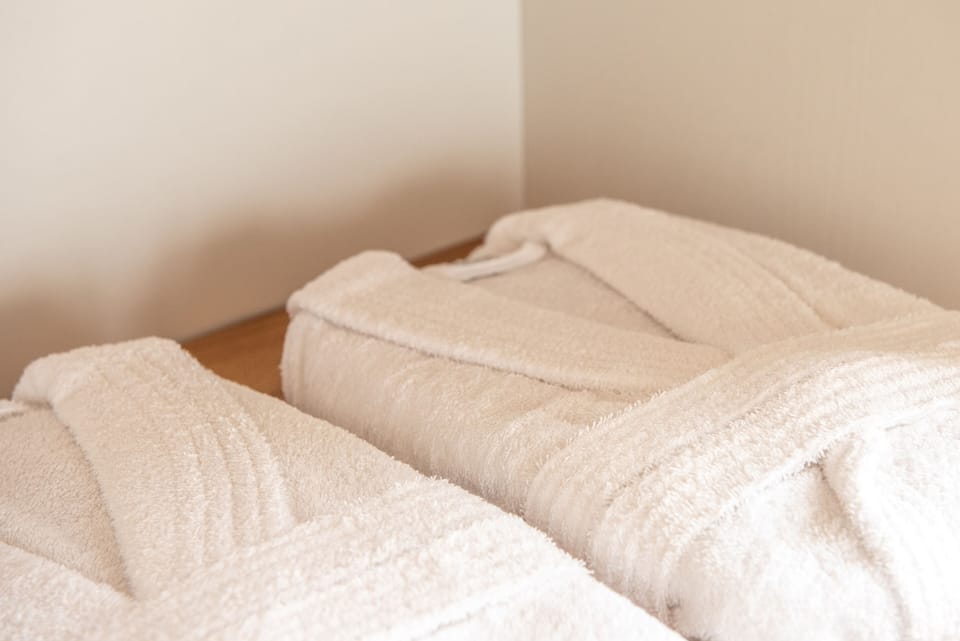 The bedroom exudes comfort and sophistication, featuring a spacious closet.