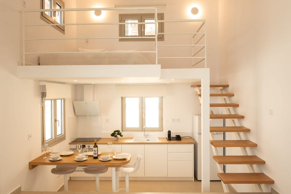 The kitchen features a chic island with elegant stands.