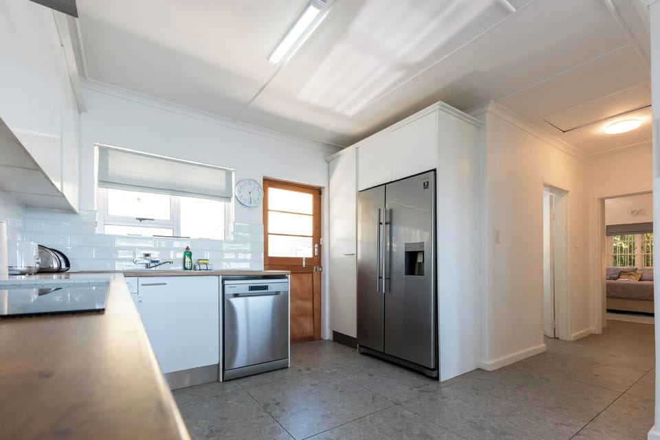 The kitchen and hallway leading to the bathroom and guest bedroom