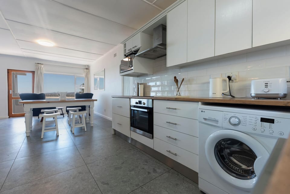 The kitchen with a washing machine 