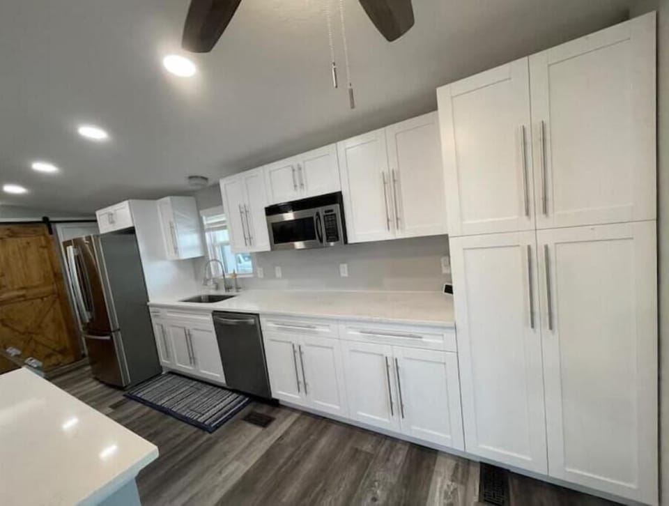 Kitchen with reverse osmosis water filter tank and separate faucet 