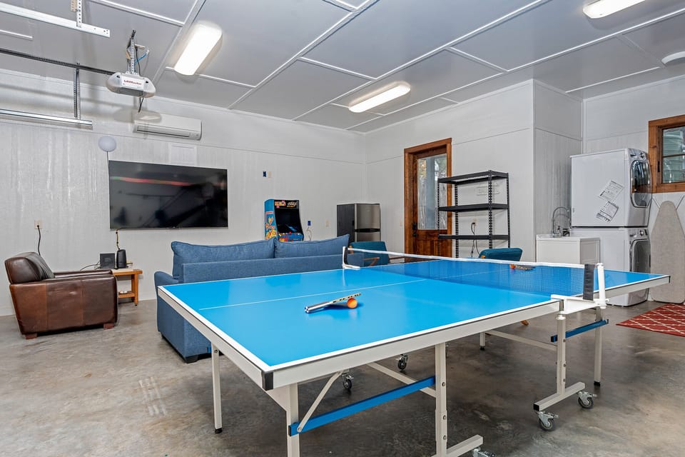 Games room with ping pong, pop a shot, arcade games and large TV