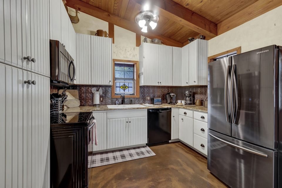 Compact appliances fit seamlessly into the layout, ensuring efficiency without sacrificing convenience.