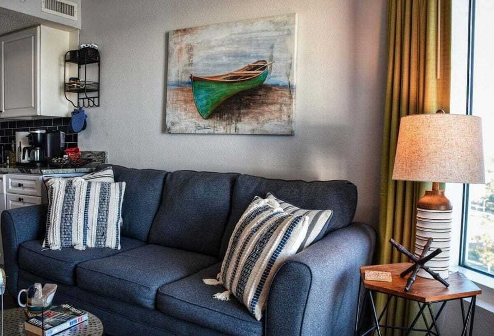 Living Room: Enjoy vibrant decor and artistic touches for a relaxing seaside retreat!