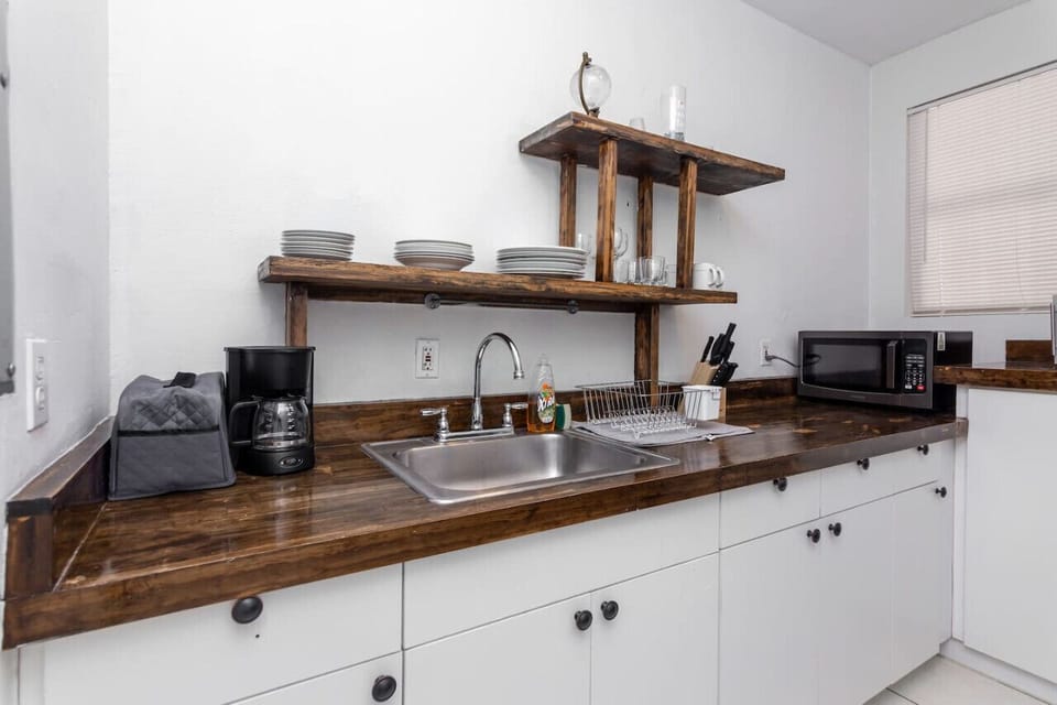 Kitchen prep area with coffee maker and cooking essentials