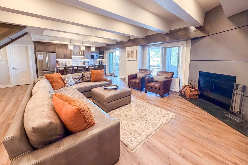 Enjoy open-concept living with direct access to the kitchen. Step through the glass slider to the gas grill on the balcony for alfresco dining!