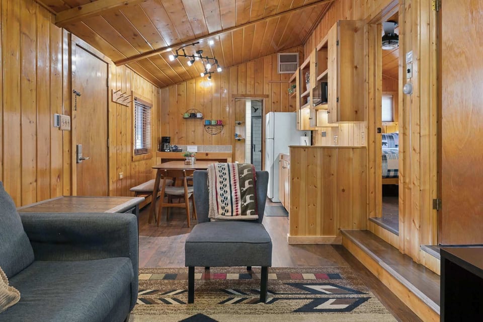 The kitchen is on the other side of the cabin and the bathroom is past that.