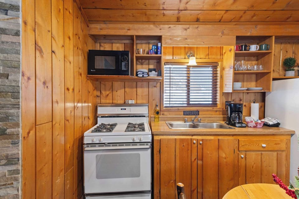 The kitchen has plenty of cookware, dishes and utensils so you can cook a meal.