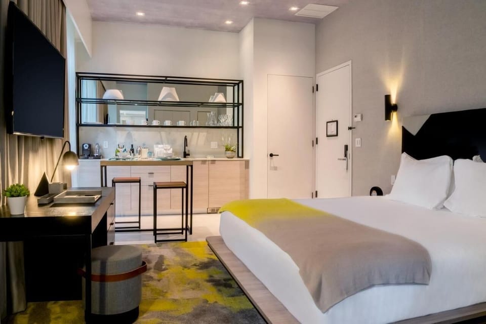 Enjoy an airy layout with sleek kitchenette and restful bed.