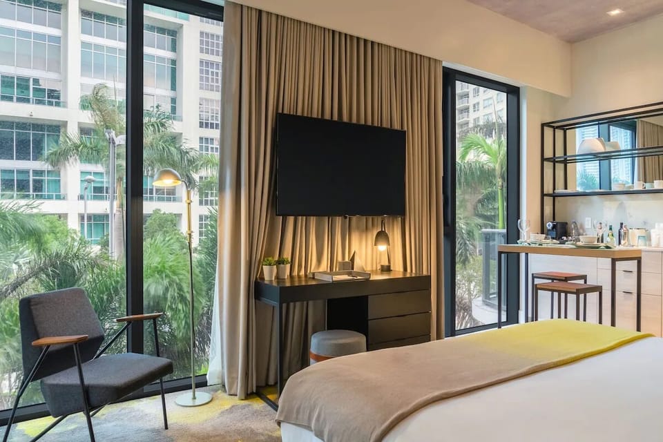 Sip morning coffee by floor-to-ceiling windows and lush scenery.