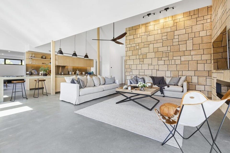 Huge, sandstone walls are featured throughout the home