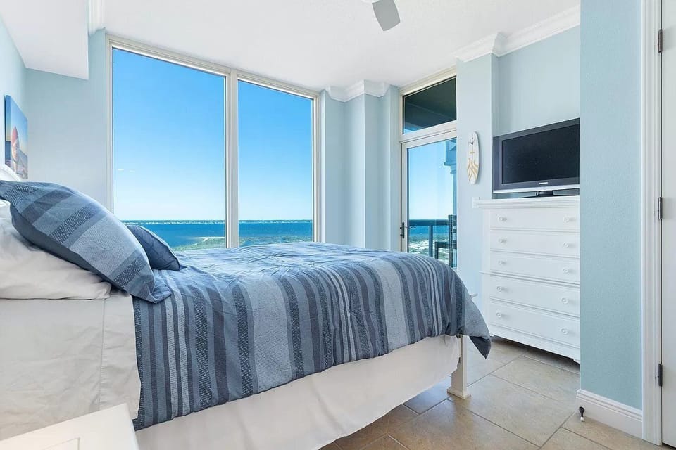 Smart TV and balcony access from bedroom 2.  