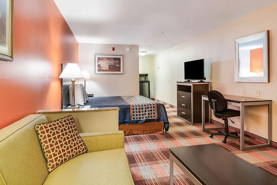 Stretch out in a spacious room with seating and bedside lighting.