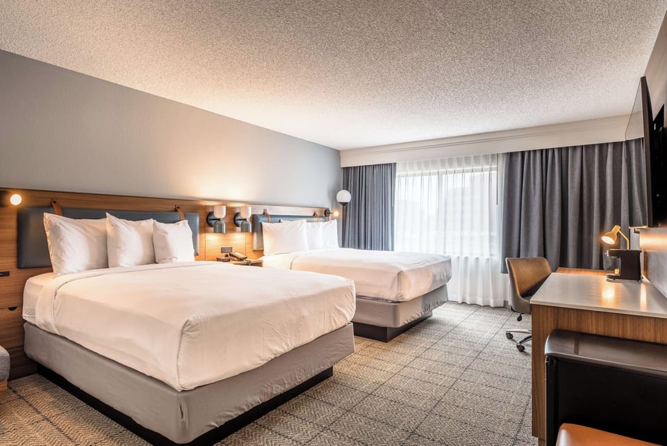 Stretch out after adventures in a bright room with two beds.
