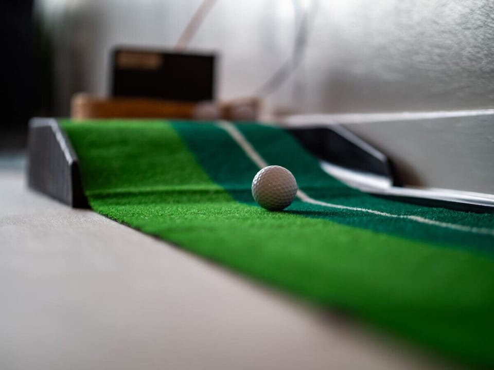 Fun putting green for indoor mini golf practice   - Playful feature adds entertainment at home   - Unique touch perfect for relaxing game nights