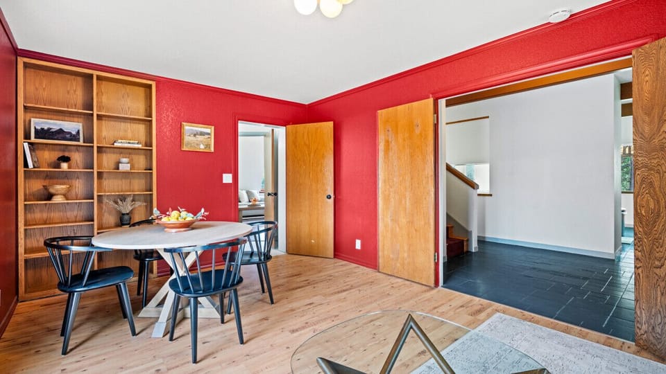 Den with sleeper sofa and extra dining space