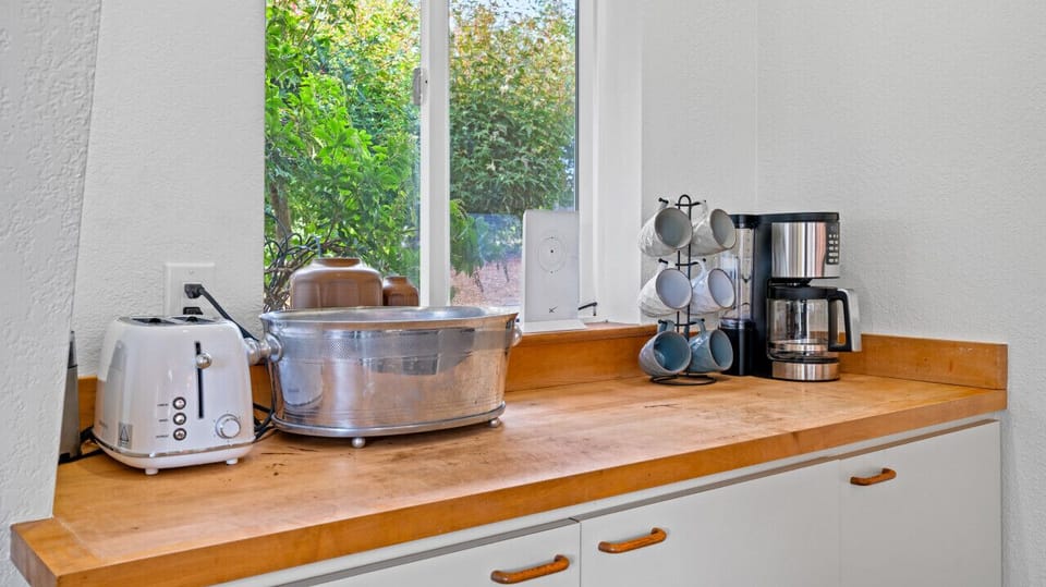 Kitchen amenities like toaster, coffeemaker and dishwasher all available