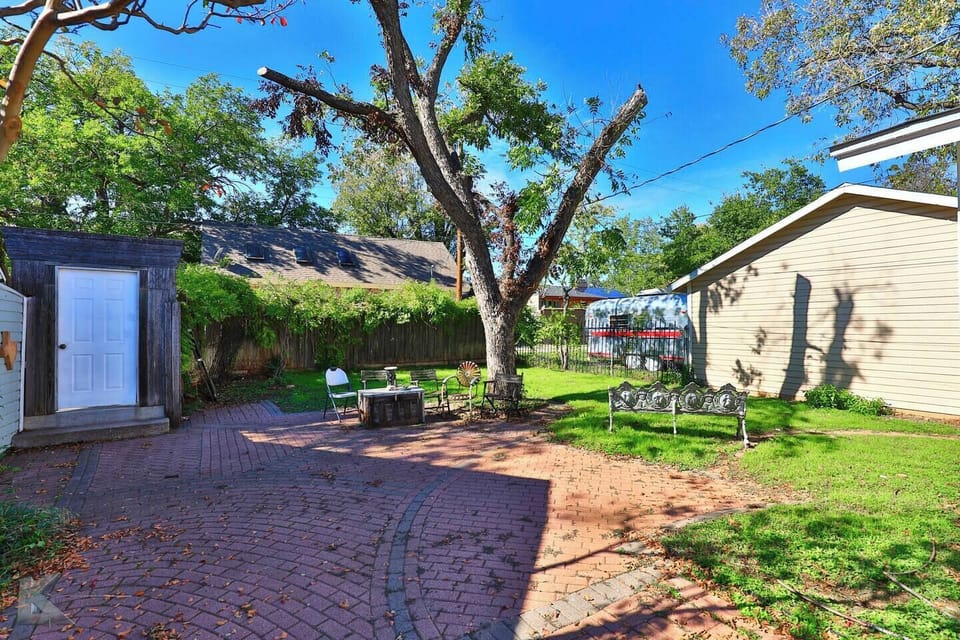 Enjoy the brick terrace of the backyard
