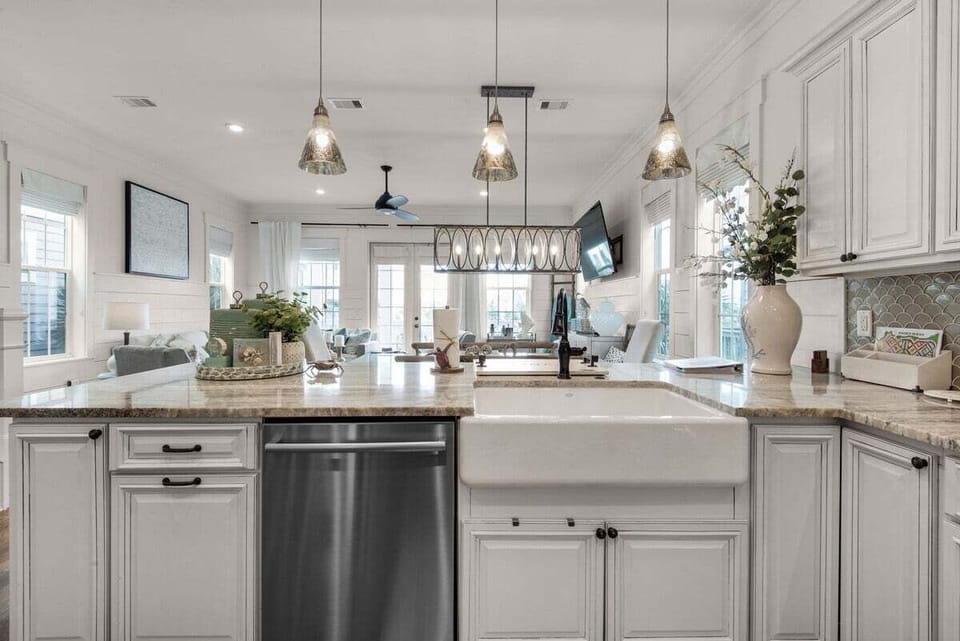Enjoy a farmhouse sink with a view, overlooking the open-concept dining room