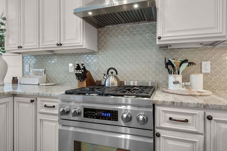 Experience culinary excellence with stainless steel and luxury appliances, including a sophisticated gas stove.