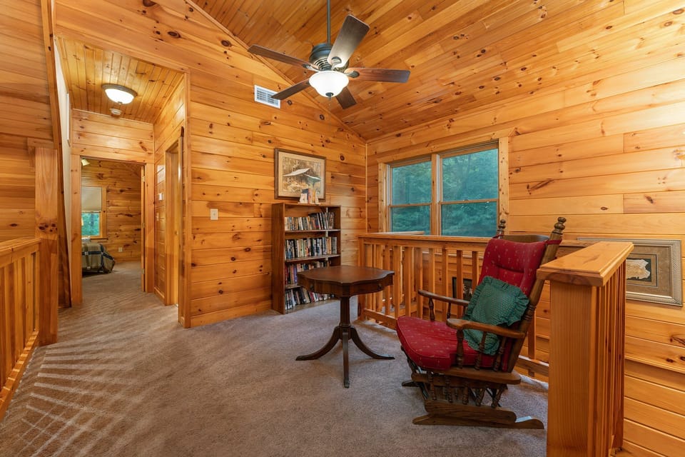 Upper-level loft with small library and sitting area
