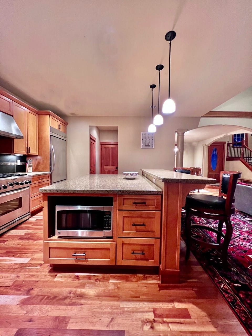 Stainless-steel appliances in the kitchen, along with beautiful hardwood floors.