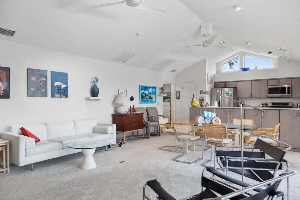 Living room with flat screen TV, overlooking lake