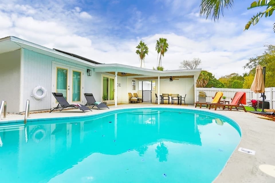 Sun loungers, dining area and a lot of amenities for your stay in our vacation rental home in Largo, Florida.