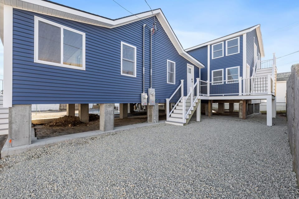 Stairs leading to the utility room and shared washer and dryer. Parking for 1 sedan, this is shared with unit 3.