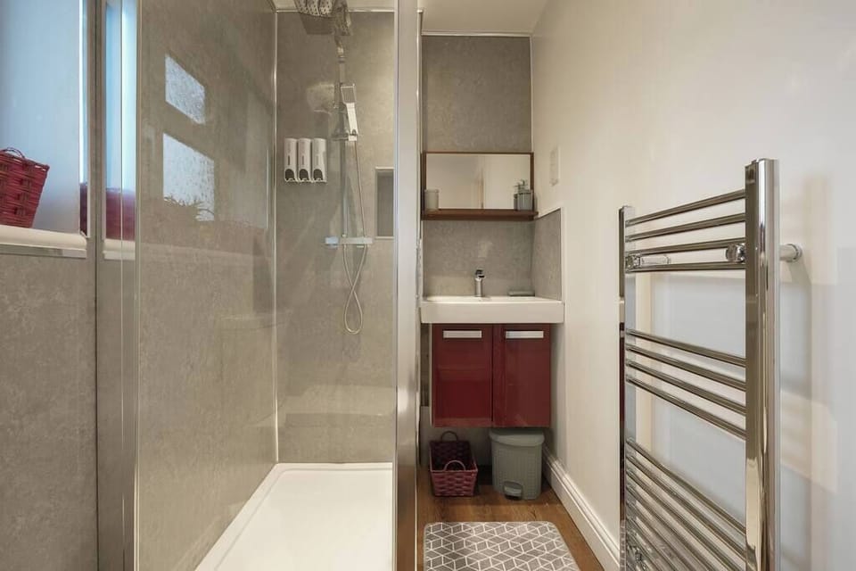 Modern bathroom designed for comfort and convenience, featuring stylish fixtures and a relaxing ambianc