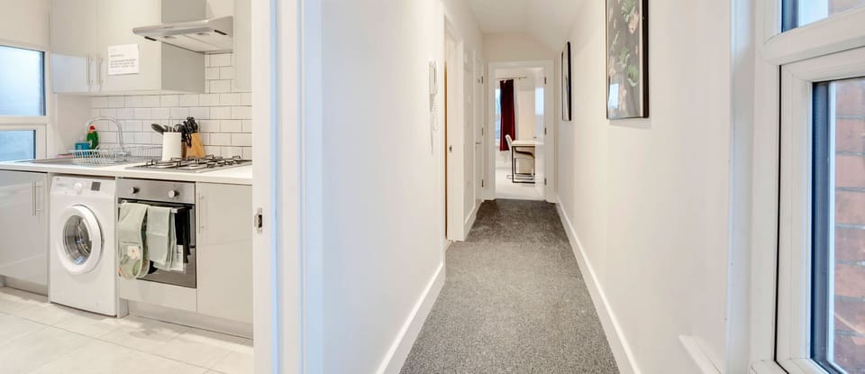 HALLWAY AND KITCHEN AREA