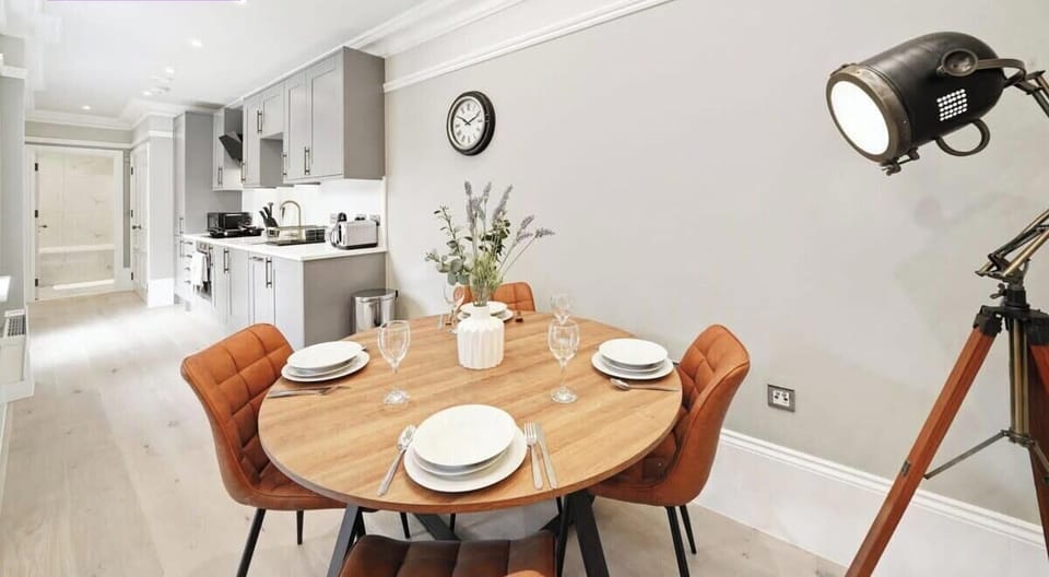 DINING TABLE WITH PLATES, GLASSES AND CUTLERIES