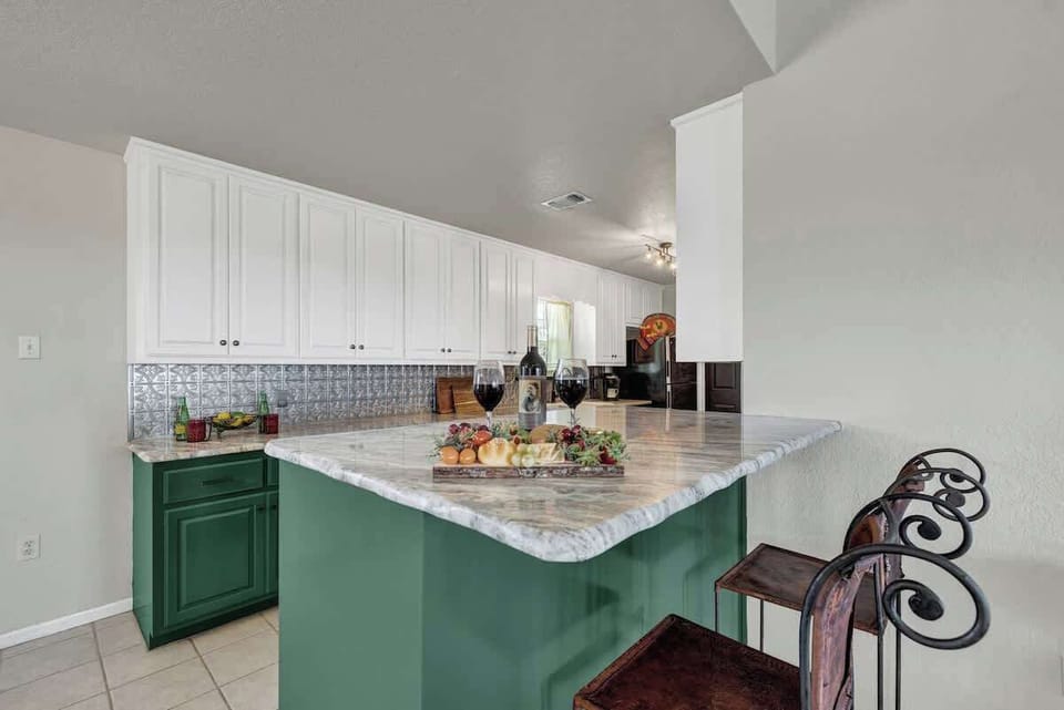 Large kitchen island with bar seating for two.