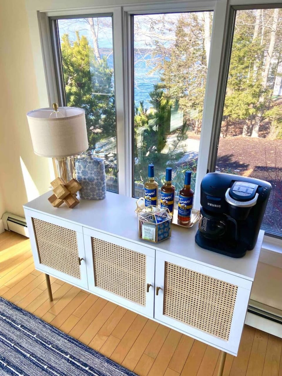 Coffee bar including complimentary k-cups, Torani sugar-free syrups, creamers and sugar. Also comes stocked with assorted organic TAZO teas including `Awake English Breakfast Tea`, `Regenerative Zen Green Tea` and `Cup of Calm Lavender Mint Tea`.