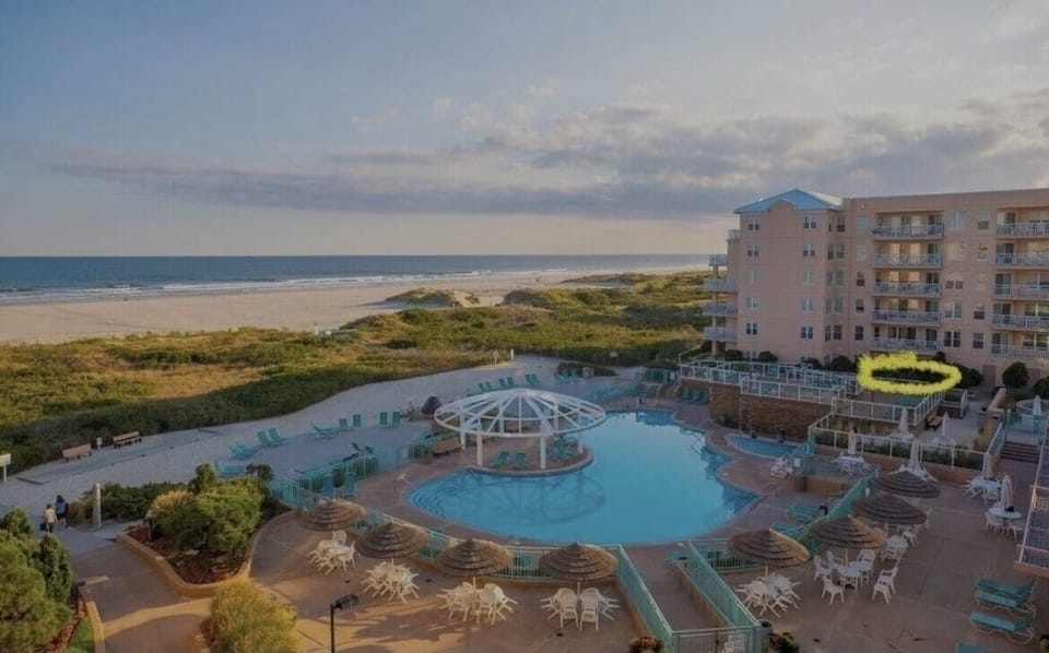 Our condo is circled in yellow! Steps from Oceanfront Pool, beach, and hottubs.