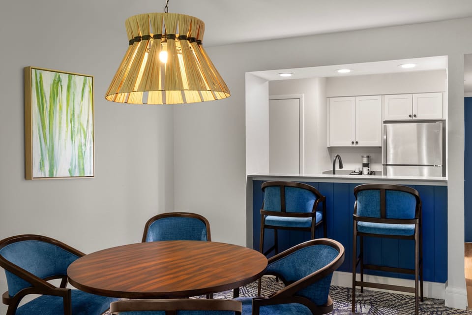Gather for meals in a chic dining space paired with the convenience of a kitchenette.