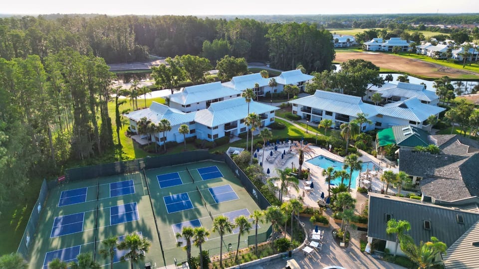 Where recreation meets relaxation — courts, pools, and palm-lined pathways await.