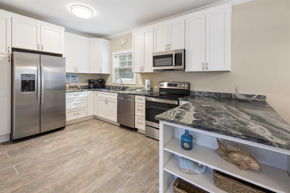 Renovated kitchen. Fully stocked-Dishes, cookware, coffee maker, blender!