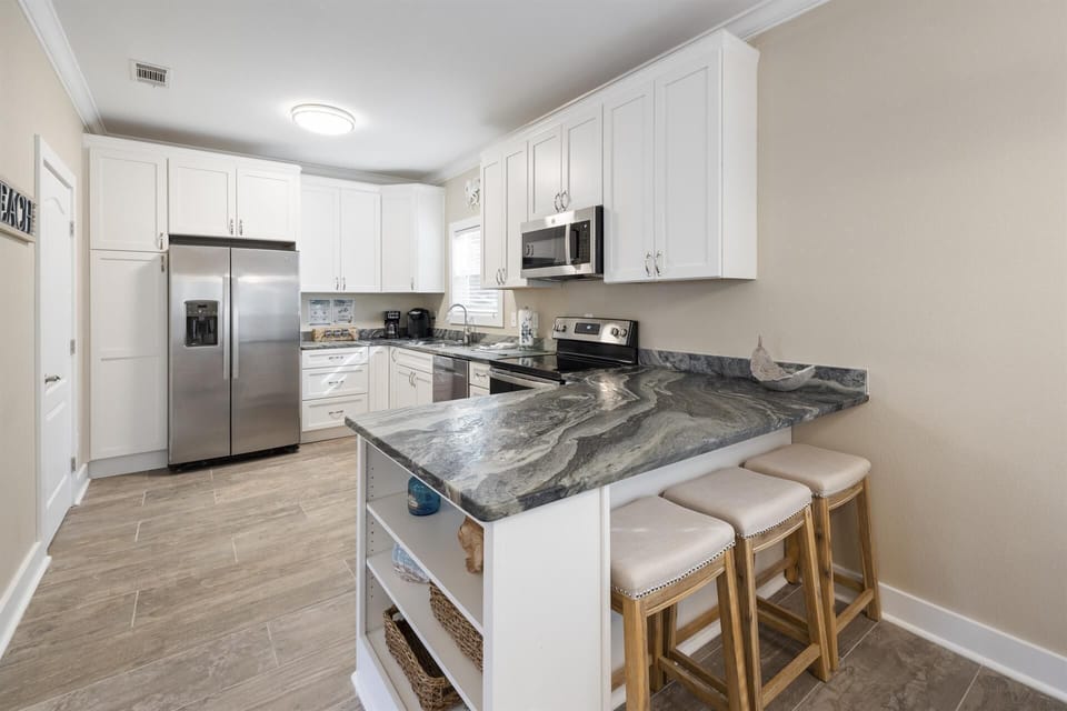Renovated kitchen. Fully stocked-Dishes, cookware, coffee maker, blender!
