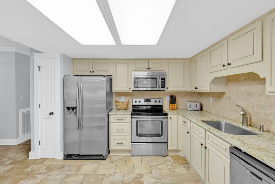 Fully stocked kitchen with stainless steel appliances