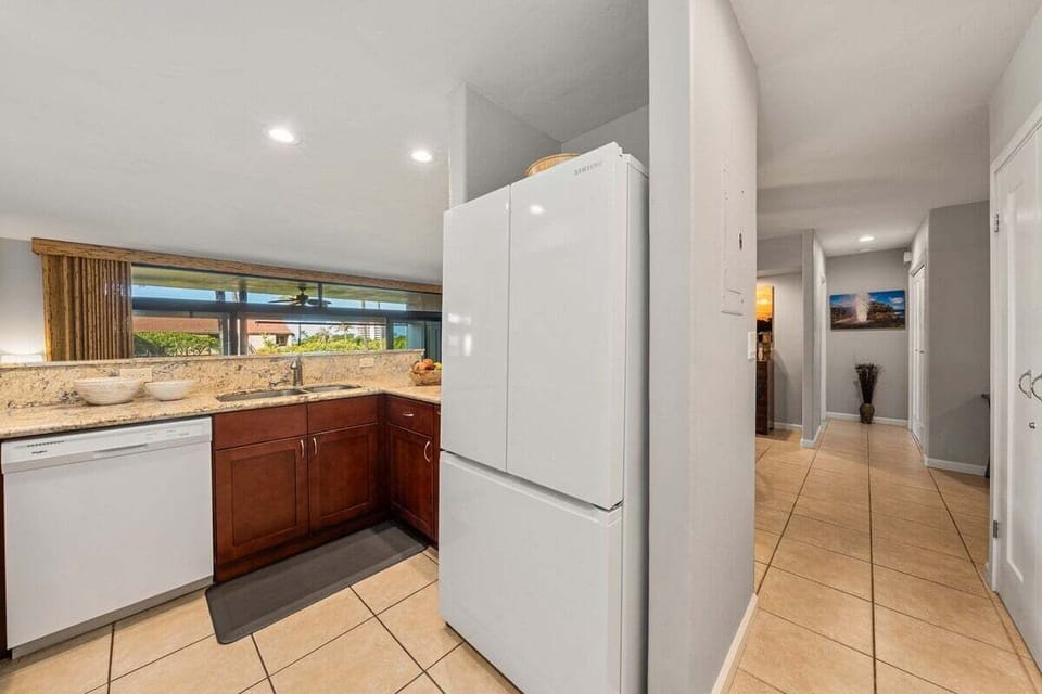 Bright and inviting kitchen space with easy access to the hallway and living areas