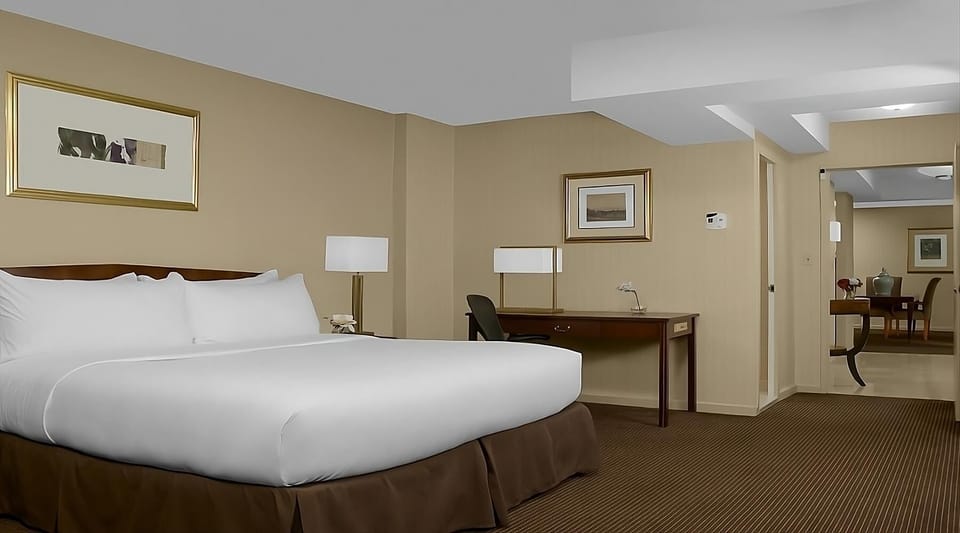 Recharge in a serene king room with extra space.