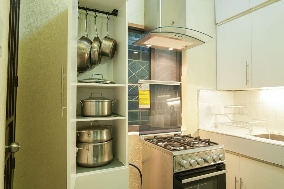 Kitchen with cooking, baking and dining amenities.