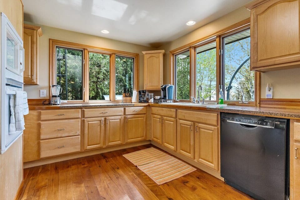 The kitchen is fully equipped with everything you could ever need to enjoy yourself. The large wrap around windows provide excellent views. 