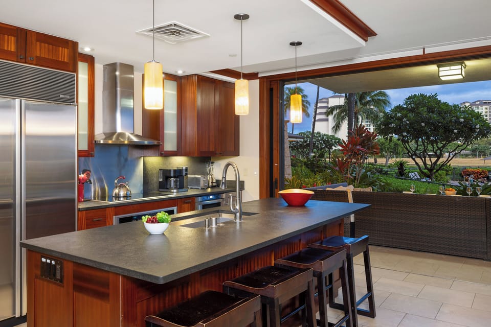 The Roy Yamaguci designed kitchen with views out of the sliding doors to the lanai.