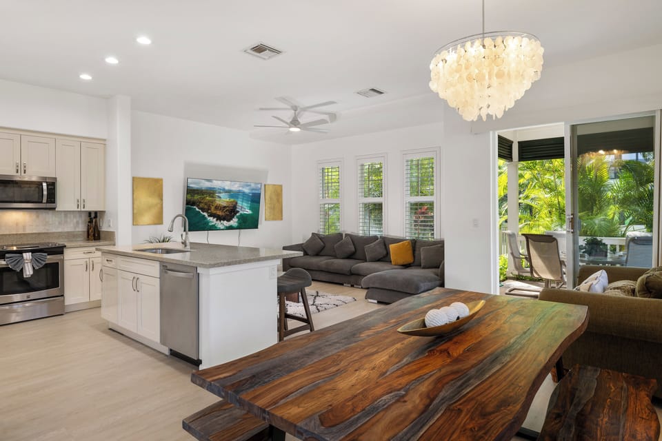 Bright, open-concept living space blends kitchen, dining, and lounging areas—ideal for gathering with friends and family.