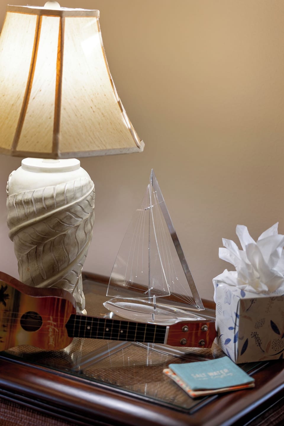 Relax in your thoughtfully decorated space with charming nautical touches and warm ambient lighting creating a cozy retreat atmosphere.