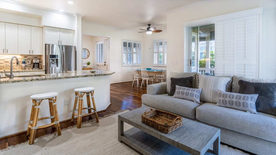 Sink into the plush seating in the living area surrounded by natural wood tones.