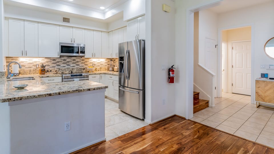 A picture of the stairs inside the condo near the kitchen.